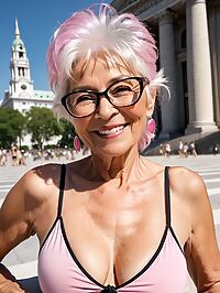 An elderly woman with wrinkled skin poses in a pink tank top at City Hall